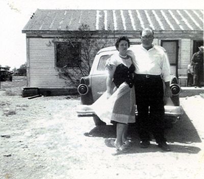 Herman and Vertie by the car