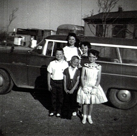 Standing in front of a car