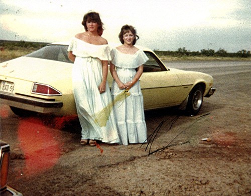 Micki and Vicki beside car